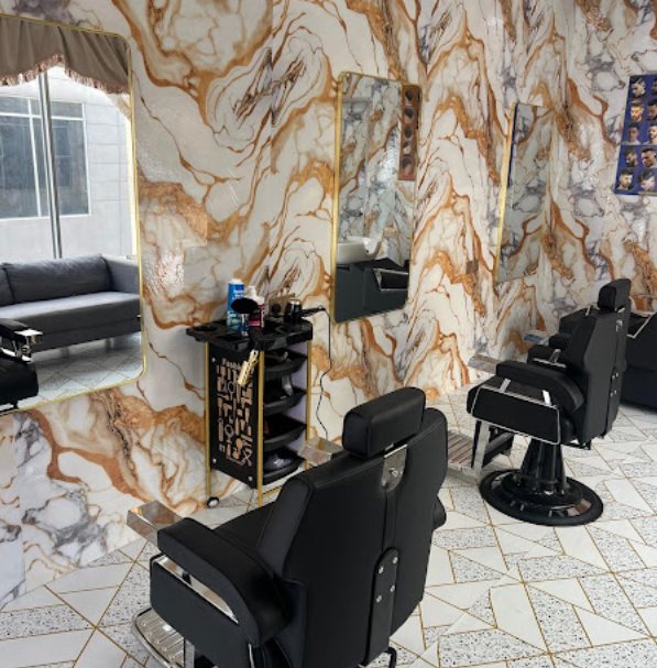 Interior of Newaj Barber Shop Setia Alam with barber chairs and marble-panelled walls